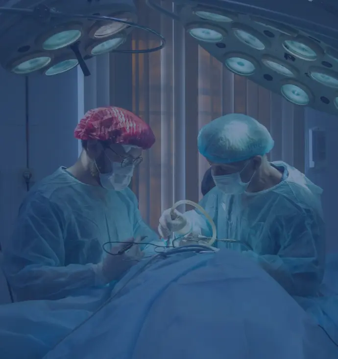 two men wearing blue lab coats